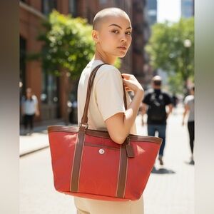 Coach Signature Gallery Tote Bag in the color Coral or Salmon with leather trim